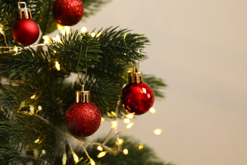 Christmas tree with decorations on a light background