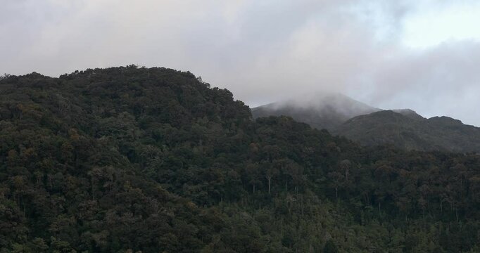 Beautiful view on the hills and rainforest surrounding San Gerardo de Dota in mist, beautiful Costa Rica Wilderness landscape