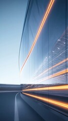 Obraz premium A sleek, modern building reflects light and motion, showcasing contemporary architecture.