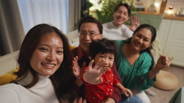 Slow motion Asian big family taking selfie together at home