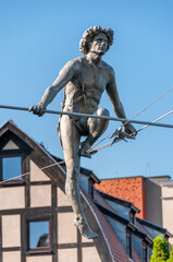 Passing through the river - a sculpture suspended on a rope by the Brda River. Bydgoszcz,...