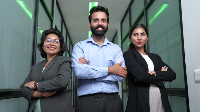Portrait of young confident successful businesspeople standing arms crossed in corporate office. Company employees, Teamwork, Job and career opportunities
