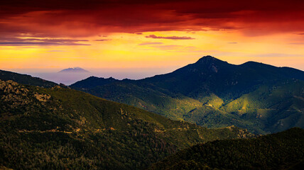 Corsican landscape with mountains in the background and spectacular clouds