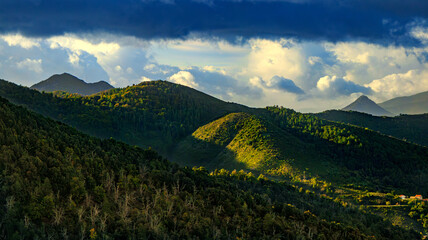 Corsican landscape with mountains in the background and spectacular clouds
