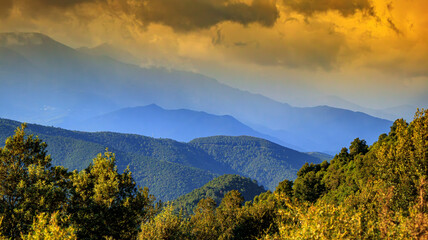 Corsican landscape with mountains in the background and spectacular clouds