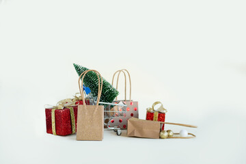 Gifts for Christmas, New Year, holiday packages and a Christmas tree on a white background. Christmas sales. 2025