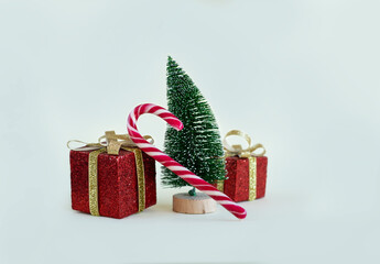 Gifts for Christmas, New Year, holiday packages and a Christmas tree on a white background. Christmas sales. 2025