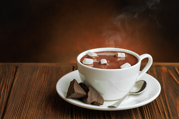 hot chocolate with mini marshmallows in cup on wooden table