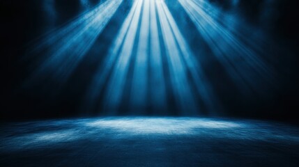 A dark stage illuminated by beams of blue light, creating a dramatic atmosphere.