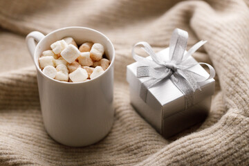 Cups of delicious hot chocolate and artisanal gift box