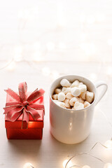 Cups of delicious hot chocolate and artisanal gift box