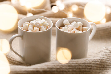 Cups of delicious hot chocolate and artisanal gift box