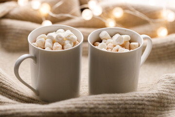 Cups of delicious hot chocolate and artisanal gift box