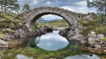 Fototapeta premium Stone Arch Bridge Over Calm Water in Nature
