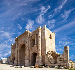 Roman ruins (against the background of a beautiful sky with clouds) in the Jordanian city of Jerash (Gerasa of Antiquity), capital and largest city of Jerash Governorate, Jordan