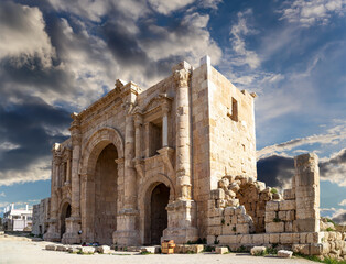 Roman ruins (against the background of a beautiful sky with clouds) in the Jordanian city of Jerash (Gerasa of Antiquity), capital and largest city of Jerash Governorate, Jordan