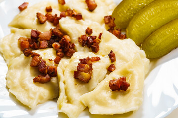 Dumplings with meat bacon scratchings.