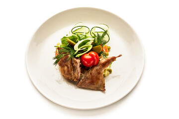A plate of food with meat and vegetables on it