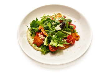 A plate of food with a salad on it