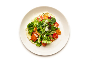 A plate of food with a salad on it