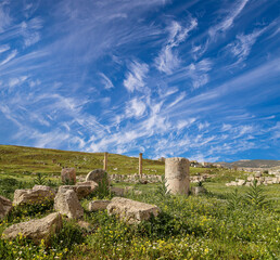 Roman ruins (against the background of a beautiful sky with clouds) in the Jordanian city of Jerash (Gerasa of Antiquity), capital and largest city of Jerash Governorate, Jordan