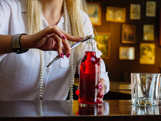 Woman working at the bar counter