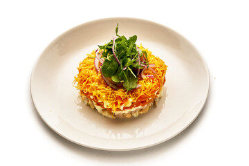 A plate of food with a variety of vegetables and cheese