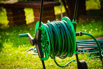 Garden hose for watering plants in garden