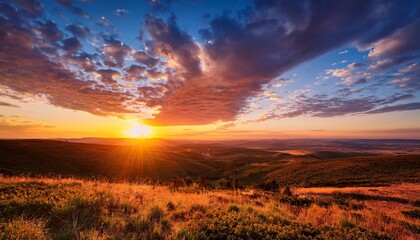 Obraz premium Dramatic Sunset Over Peaceful Wilderness with Vibrant Cloudscape