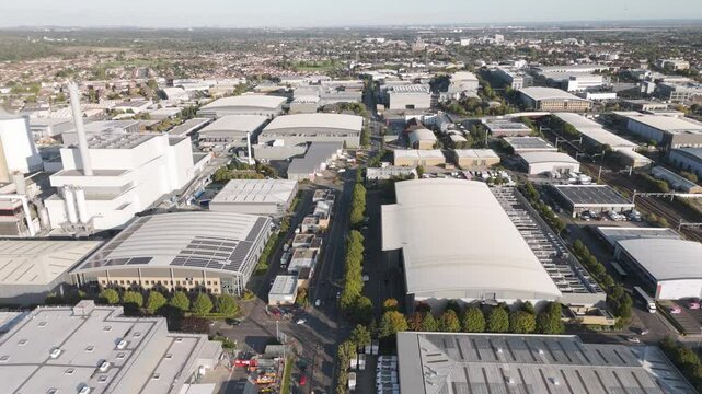 Golden hour drone footage revealing Slough's industrial estates, highlighting modern data centres and manufacturing facilities against cityscape