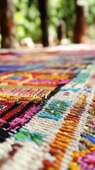Fototapeta premium A close-up shows the vibrant patterns and textures of a handwoven Brazilian rug outdoors