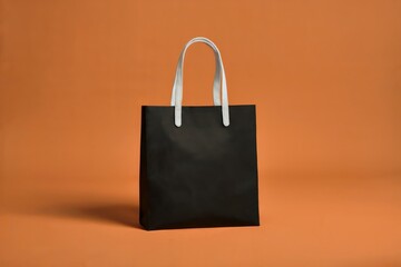 White tote bag with handles on vibrant orange background, upright with subtle shadows and bold contrast for a modern, minimalist aesthetic
