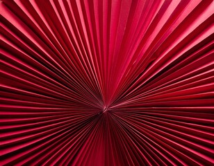 Close-up of a red paper fan or pleated surface radiating from a central point