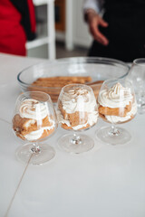 Tiramisu cake in glass jars. Traditional italian layered dessert in glasses. Closeup view. stock photo