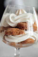 Tiramisu cake in glass jars. Traditional italian layered dessert in glasses. Closeup view. stock photo