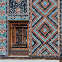 Vibrant colors and geometric patterns adorn the walls of Shaki Khans Palace in Azerbaijan. The ornate wooden window showcases traditional Azerbaijani design, reflecting the rich cultural heritage