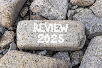 Planning review 2025 new year symbol. Concept words Review 2025 on beautiful grey stone. Beautiful grey stones background. Business review 2025 new year concept. Copy space.