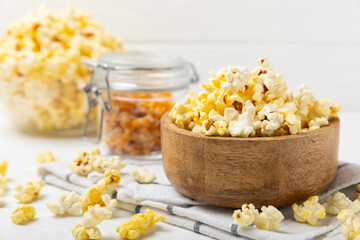 Salty popcorn on bright color background. Cinema and entertainment concept. Movie night with popcorn. Delicious appetizer, snack.Space for text, copy space. Banner