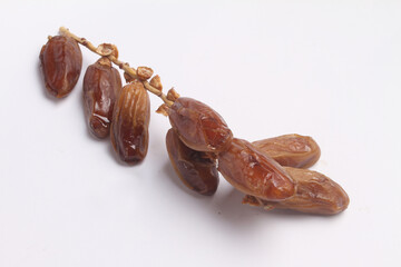dried dates on white background