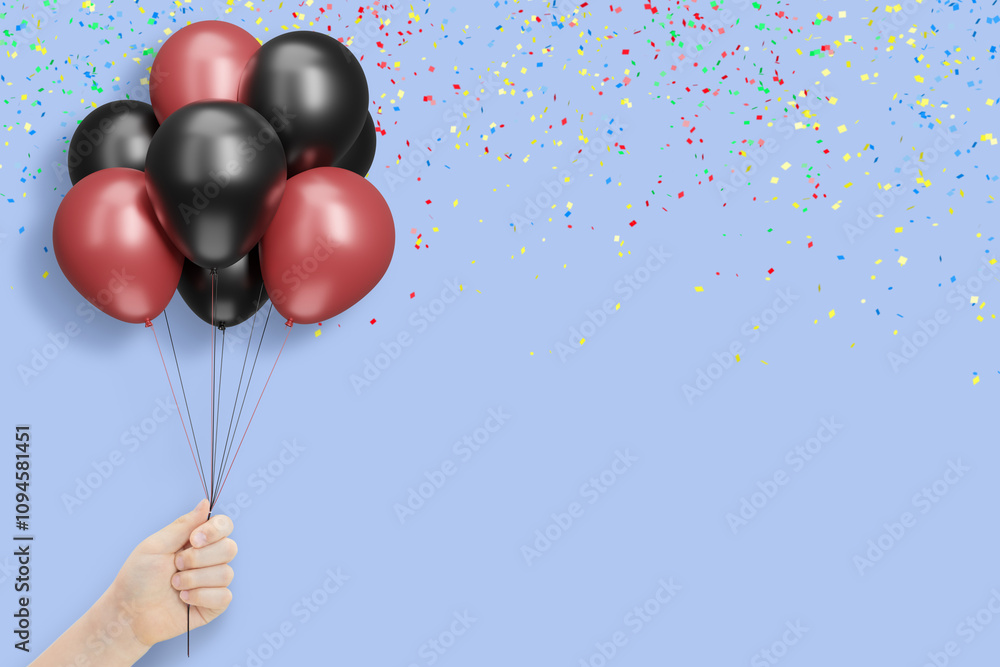 Poster female hand holds bunch of red and black balloons on blue background with confetti. empty space for 
