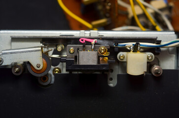 Electronic components and mechanisms close-up, diagnostics and repair, dust, retro