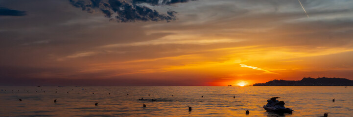 Sunset on the beach in Albania with beautiful clouds © Grzegorz
