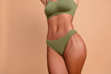Studio cropped no retouch photo of sexy lady abdomen dressed lingerie loving herself copy space...