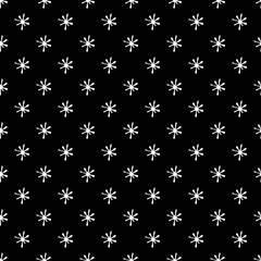 Christmas seamless background with white snowflakes. Hand drawn illustration in sketch style. Template for wrapping paper and textile.