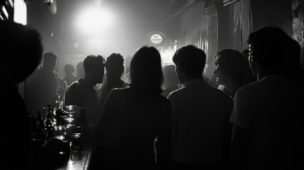 Naklejka premium Silhouettes of people in a bar at night.