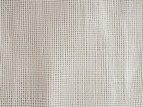 Close-up of a intricately woven linen fabric, threadbare
