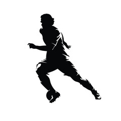 A man in a black shirt and shorts is kicking a soccer ball. He is running and kicking the ball with his right foot