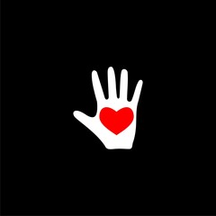 Red heart of love in the palm of your hand icon isolated on black background.