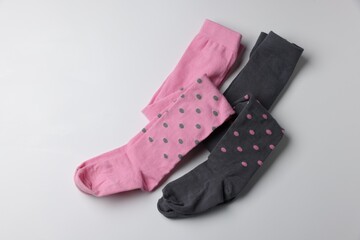 Different child's tights on white background, top view