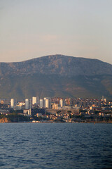 Fototapeta premium Contemporary buildings, gardens and beaches at the waterfront in Split, Croatia. View of Split from the boat.